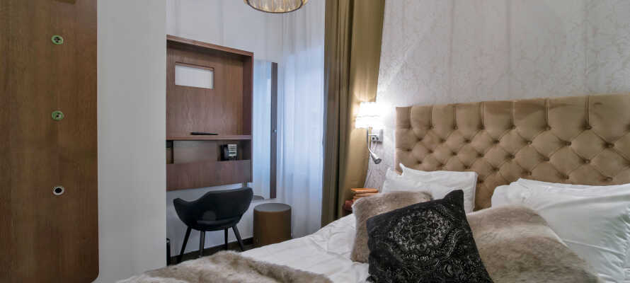 Overnat i stilfulde og moderne værelser, Sengene er meget behagelige og vil sikre jer en god nats søvn.
